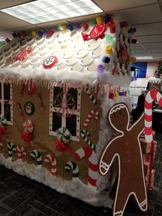 a large gingerbread house decorated for christmas