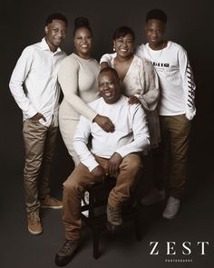 a group of people posing for a photo in front of a black background with the caption zest photography