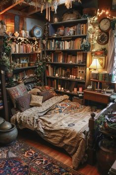 a bed sitting in a bedroom next to a book shelf filled with lots of books