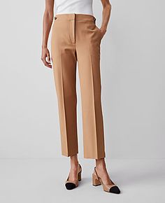 Elevate your wardrobe with the Ann Taylor Button Pencil Pant in Twill, a testament to sophistication and comfort. These pants are designed to flatter with a high-rise, tailored fit that sits just below the natural waist, and a slim leg that hits at the ankle. Perfect for both office and casual wear, these pants ensure you look polished and poised.

- Size: Regular - 2
- Color: Perfect Camel
- Gender: Female
- Material: 54% Viscose, 39% Cotton, 7% Lyocell
- Fit: Tailored and fitted
- Rise: High r Straight Hem Pants With Button Closure For Work, Tapered Leg Dress Pants With Button Closure For Work, Brown Workwear Bottoms With Button Closure, Brown Bottoms With Button Closure For Work, Elegant Brown Pants With Button Closure, Solid Flat Front Pants For Work, Flat Front Bottoms For Workwear In Fall, Chic Tailored Bottoms With Flat Front, Versatile Brown Bottoms For Workwear