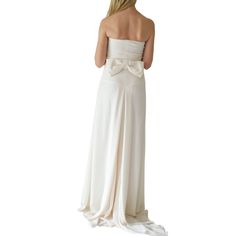 Elegantly adorned with an oversized bow, Valentino's ivory silk strapless gown is a subtle update of the classic column style. Internal zip-fastening boned corset, softly folded pleats at bow-embellished back Draped fishtail Fully lined Internal structure at bodice Cut for a close fit through the body Concealed zip fastening at side Composition: 100% SilkLining: 100% SilkDry clean Made in Italy Bust 32" Waist 30.5" Hip 42.5" Length 67.5" Strapless Wedding Dress With Satin Bow, Elegant Strapless Gown With Bow, Wedding Strapless Dress With Bow And Fitted Bodice, Strapless Wedding Dress With Bow And Fitted Bodice, Pre-draped Strapless Wedding Dress With Pleated Bodice, Silk Strapless Wedding Dress With Boned Bodice, Pre-draped Silk Strapless Dress For Wedding, Classic Column, Strapless Gown