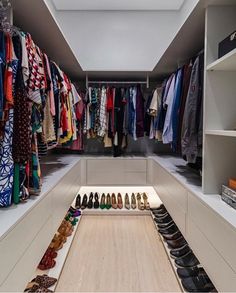 an organized closet with shoes and scarves