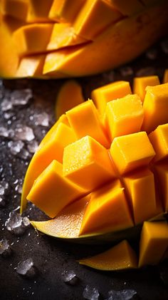 sliced up mangos sitting on top of a table