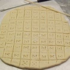 an uncooked pizza sitting on top of a table