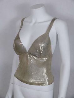 For Sale on 1stdibs - PACO RABANNE silver metal mesh tank top. Rectangular metal label reads PACO RABANNE. Indicative measurements taken laid flat : length approx 47 cm (18.50 Silver Tank Top, Silver Outfits, Clubbing Outfits, Night Club Outfits, Mesh Tank Top, Metal Fashion, Metal Mesh, Paco Rabanne, Festival Outfits