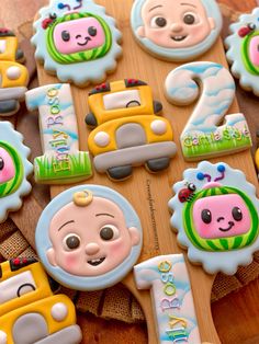 some decorated cookies are sitting on a table