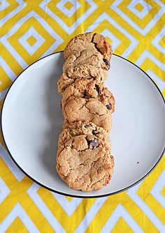 a white plate topped with cookies on top of a yellow and white table cloth