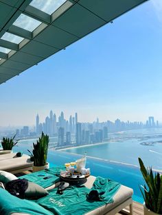 an outdoor lounge area overlooking the city skyline