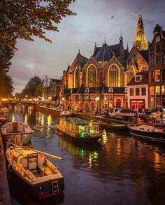 an instagram page with boats on the water in front of buildings and clock tower