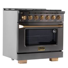 an image of a silver stove with gold knobs