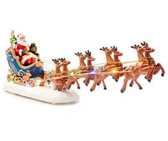 a santa claus sleigh with reindeers and lights on it's side