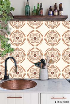 a copper sink sitting under a wooden shelf next to a wall mounted faucet