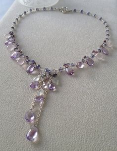 Inspired by the lavender fields in France, this necklace embraces the light violet colors of the flowers and the silvery white foliage surrounding the Amethyst Multi-stone Pendant Jewelry, Multi-stone Amethyst Pendant Jewelry, Purple Multi-stone Pendant Necklace, Elegant Briolette Crystal Healing Necklace, Elegant Purple Multi-stone Necklaces, Elegant Purple Multi-stone Necklace, Lavender Amethyst Drop Necklace, Exquisite Amethyst Pendant Necklace, Fusion Style Amethyst Multi-stone Jewelry