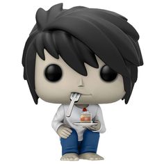 a pop vinyl figure with black hair sitting on top of a white table next to a cup