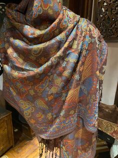 This is one of our favorites and certainly the most popular in a deep jewel tone on black, 28 X 70 inch This vintage-styled shawl features our paisley brocade design, styled from ancient Jamawar Kashmiri motifs Very soft and durable silk blend Free shipping in the US Our shawls arrive wrapped in tissue paper in a stylish peacock mailer. Gift wrap is available. Thank you Etsy community for your support! We are grateful for thousands of great reviews! Traditional Paisley Print Shawl For Fall, Multicolor Paisley Print Pashmina Shawl, Multicolor Paisley Print Pashmina, Brown Pashmina Shawl With Paisley Print, Brown Paisley Pashmina Shawl, Vintage Multicolor Festive Shawl, Festive Vintage Multicolor Shawl, Elegant Multicolor Paisley Print Dupatta, Kashmiri Motifs