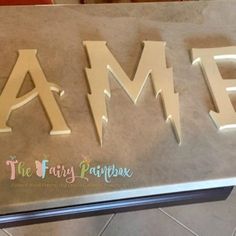 the letters amf are cut out of paper and placed on top of each other