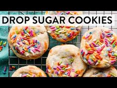 several sugar cookies with sprinkles on a cooling rack