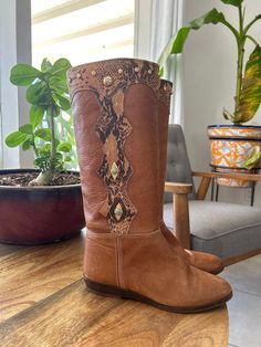 Handsome, sable colored, studded leather boots. In overall rustic vintage condition, wear across the toe and some light surface scratches. There is also a stud missing on the top of the left boot. Tag reads Currano, made in Italy  size 38.5. Heel to toe measures 10in/25.5cm, almost 3.25in/8.5cm across bottom of sole, and heel measures 1in/2.5cm.  Follow us on Instagram @littlemissvintage3 https://www.Instagram.com/littlemissvintage3 *Please read all policies on this and our policy page prior to Vintage Hand Tooled Boots With Round Toe, Western Brown Boots With Rivets, Vintage Hand-tooled Boots With Round Toe, Vintage Brown Boots With Stitched Sole, Vintage Leather Knee-high Lace-up Boots, Studded Brown Ankle Boots, Leather Western Knee-high Boots With Snip Toe, Brown Studded Ankle Boots, Vintage Brown Ankle-high Moto Boots