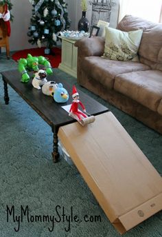 a living room filled with lots of furniture and christmas decorations on top of a coffee table