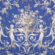 an ornate blue and white wallpaper with cherubs