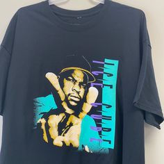 Ice Cube T-Shirt Nwot Bin 64 90s Style Black Relaxed Fit T-shirt, 90s Black Relaxed Fit T-shirt, Black 90s Style Relaxed Fit T-shirt, Black Relaxed Fit 90s T-shirt, 90s Style Black Shirt With Graphic Print, 90s Black T-shirt With Graphic Design, Black 90s Style T-shirt For Fan Merchandise, 90s Black Crew Neck Top, 90s Style Black Screen Print Tops