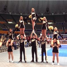 a group of cheerleaders standing on top of each other