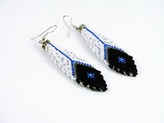 black and white beaded earrings with blue eyes