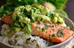 salmon with avocado and rice in a bowl