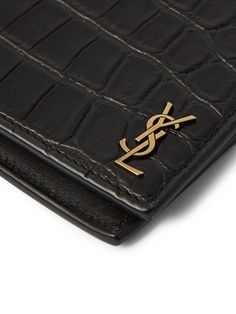 SAINT LAURENT's wallet is ideal for various credit, business and ID cards. It's made from glossy croc-effect leather and detailed with the house's iconic YSL monogram in gold. Luxury Crocodile Pattern Card Holder, Luxury Crocodile Pattern Business Wallets, Luxury Crocodile Pattern Wallet For Business, Luxury Crocodile Pattern Wallets For Business, Luxury Business Wallets With Crocodile Pattern, Luxury Wallets With Crocodile Pattern For Business, Designer Crocodile Pattern Wallet, Luxury Crocodile Pattern Rectangular Wallet, Luxury Wallet With Crocodile Pattern