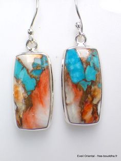 Turquoise Spiny Oyster rectangular earrings in 925 silver Spiny Oyster Turquoises are a composite of Arizona turquoise and spiny oyster. The two minerals are welded together by white metal or copper. Total height of earrings 4.1 cm Width of earrings 1.2 cm Real turquoise and oyster Hallmarked Silver 925 Comes with certificate of authenticity Sterling Silver Rectangular Gemstone Earrings, Artisan Turquoise Rectangular Jewelry, Nickel Free Turquoise Rectangular Jewelry, Nickel-free Multicolor Rectangular Earrings, Rectangular Natural Stone Earrings For Gifts, Unique Sterling Silver Rectangular Earrings, Unique Nickel-free Rectangular Jewelry, Unique Nickel Free Rectangular Jewelry, Handmade Southwestern Rectangular Jewelry