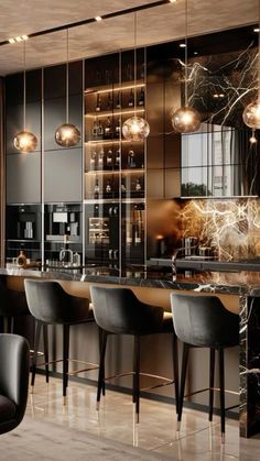 an elegant kitchen with marble counter tops and bar stools next to the bar area