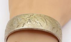 "BOJAR 925 Silver - Vintage Shiny Etched Floral Pattern Bangle Bracelet - BT2473  BOJAR 925 Silver - Vintage Shiny Etched Floral Pattern Bangle Bracelet - BT2473  Jewelry Type:         Bracelet  Metal Type:            925 Silver  Metal Size:             2\" Diameter  .75\" Height   Stone Type:            N/A  Condition:              N/A  Jewelry Weight:     37.7 Grams  PLEASE NOTE: THIS ITEM IS PRE-OWNED. ALTHOUGH MOST ITEMS ARE IN VERY GOOD CONDITION, SOME MAY NEED CLEANING AND/OR MINOR REPAIRS. WE MAKE A VERY STRONG EFFORT TO UPLOAD CLEAR PICTURES. PLEASE INSPECT ALL PICTURES AND ASK ALL QUESTIONS YOU MAY HAVE PRIOR TO MAKING A PURCHASE. NOT ALL STONES ARE GENUINE, SOME ARE ENHANCED OR CREATED." Clear Pictures, Bracelet Metal, Metal Bracelets, Bangle Bracelet, Etching, Types Of Metal, Metallic Silver, Bangle Bracelets, 925 Silver