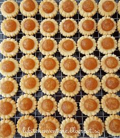 small cookies are arranged on a cooling rack to be baked in the oven or used as appetizers