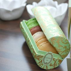 two boxes with different types of pastries in them