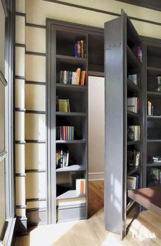 an open bookcase in the corner of a room