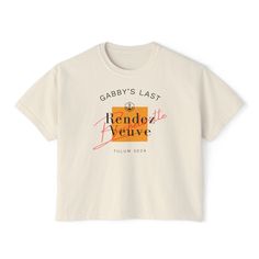 a white t - shirt with an orange and yellow graphic on the front that says goodbye's last