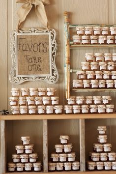 there are many small jars on the shelf