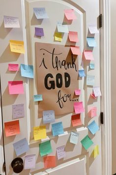 a door decorated with post it notes that say thank god for