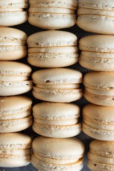 a bunch of white macaroons stacked on top of each other