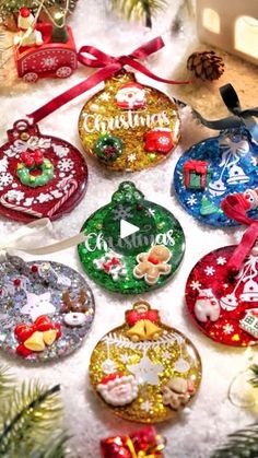 an assortment of christmas ornaments sitting on top of a table