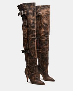 Expertly crafted, the BADDIE boot is both edgy and practical. Made with a pointed toe and buckle detail, these over-the-knee heeled boots offer a unique touch to any outfit. Elevate your style with these statement boots. 3.5 inch heel height Size 6 measurements: 16.5 inch shaft circumference, 22 inch shaft height Size 8 measurements: 17.25 inch shaft circumference, 22.5 inch shaft height Size 10 measurements: 18 inch shaft circumference, 23 inch shaft height Leather upper material Vegan leather Statement Boots, Resale Clothing, Open Toe Boots, Steve Madden Boots, Dress Loafers, Chic Leather, Leather Socks, 5 Inch Heels, Moto Boots