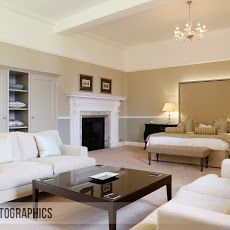 a living room filled with furniture and a fire place