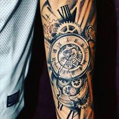 a man with a clock tattoo on his arm