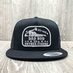 This Dad Bod "It's a Father Figure" funny embroidered patch on an all black Yupoong 6006 Classic high-crown mesh snapback baseball cap. Our patches are super high-quality and embroidered here in the USA. Each hat is made to order. We know you will love it! Fitted Black Trucker Hat, Black Fitted Trucker Hat, Black Embroidered Trucker Hat, Embroidered Black Trucker Hat, Black Trucker Hat For Father's Day, Black Embroidered Trucker Cap, Adjustable Embroidered Black Trucker Hat, Novelty Black Hat With Letter Print, Black Embroidered Snapback Trucker Hat