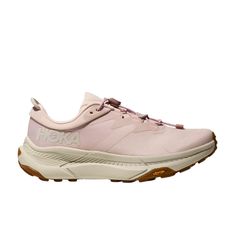 HOKA Women's Transport Cosmic Pearl/Oat Milk/Pink 1123154-CMCP The all-new HOKA Transport is the perfect on-the-go shoe for those who are always on to the next thing. Focused on everyday comfort, this balanced shoe allows you to wear it between all your favorite activities; walking, biking, or hiking. Sustainability-focused and made with vegan, recycled, and natural materials; so it's good for the environment and it's good for you too. The quick-toggle lace makes this shoe easy for on and off. V Pink Slip-on Sneakers For Walking, Outdoor Pink Sneakers With Rubber Sole, Pink Outdoor Sneakers With Rubber Sole, Pink Outdoor Running Shoes With Rubber Sole, Pink Sneakers With Boost Midsole For Outdoor Activities, Pink Running Shoes Round Toe For Outdoor, Pink Rubber Sole Sneakers For Outdoor Activities, Pink Sneakers With Rubber Sole For Outdoor Activities, Pink Low-top Sneakers With Vibram Sole