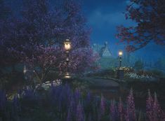 a street light sitting in the middle of a lush green park at night with purple flowers