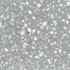 the texture of concrete with small rocks and gravel on it, as seen from above