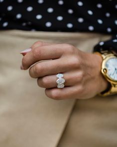 a close up of a person's hand with a watch on their left wrist