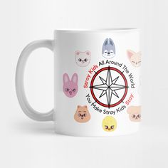 a white coffee mug with various cats and animals around the compass on it's side