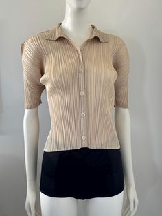 Issey Miyake Pleats Please light tan beige collared pleated button up top with short sleeves. Estimated to be from Fall 2016. Marked size: 3 (JP M) Recommended for those who typically wear a US size S or M, although it's very stretchy so I would say that OSFM (one size will fit most). I usually wear an XS and find it to be a bit too loose on me. Issey Miyake Pleats, Issey Miyake Pleats Please, Pleats Please, Beige Top, Button Up Top, Light Tan, Issey Miyake, Favorite Things Gift, Womens Clothing Tops